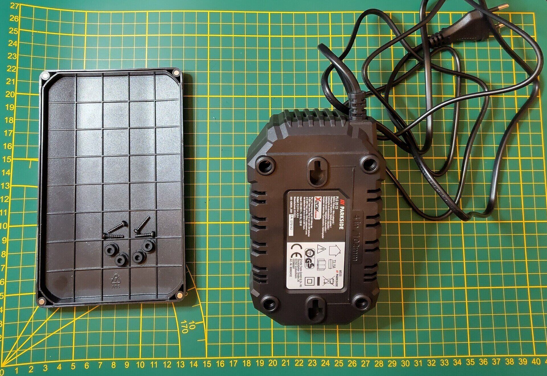 Shows the backside of the Parkside 20V Charger with screws