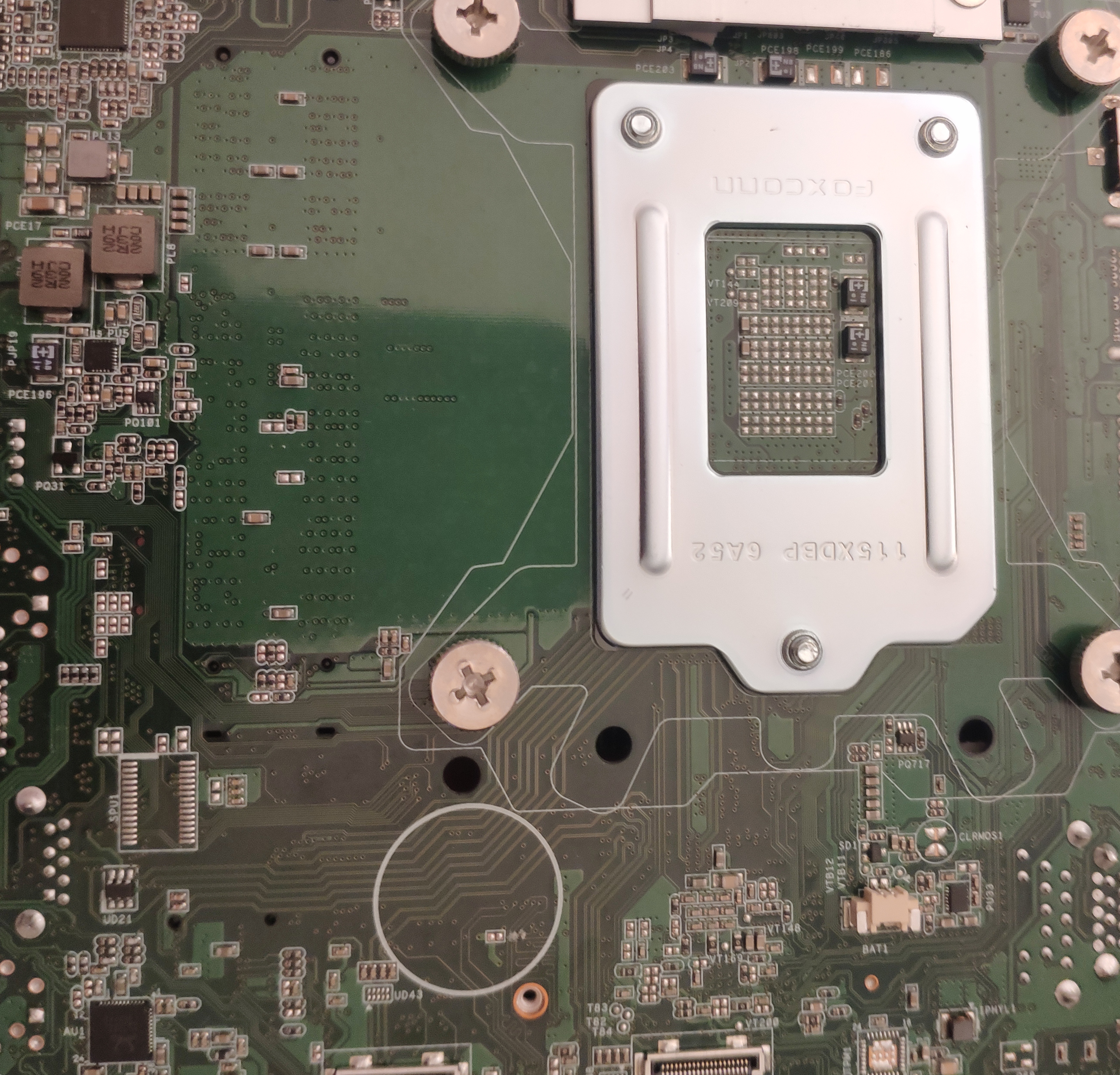 Shows the empty spot on the motherboard for the CMOS